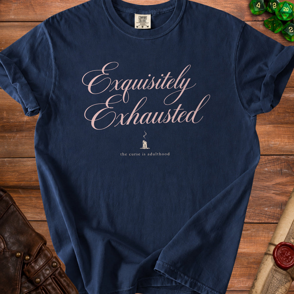 Navy t-shirt with "Exquisitely Exhausted" and "the curse is adulthood" text.