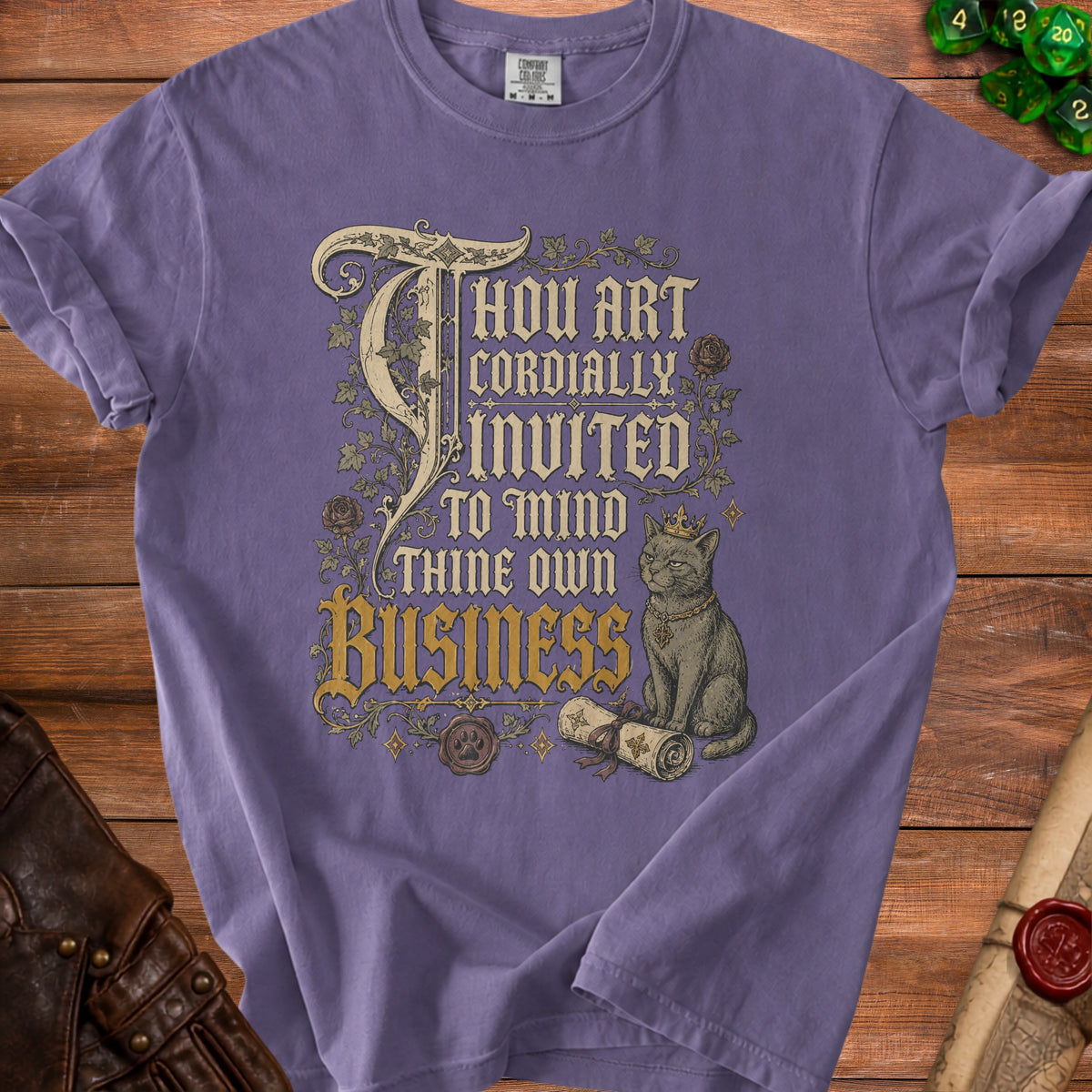 Purple t-shirt with "Thou Art Cordially Invited To Mind Thine Own Business" text and cat graphic.
