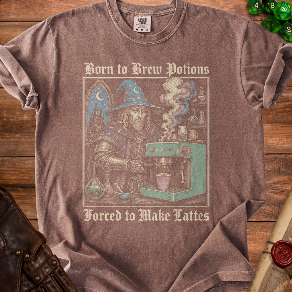 T-shirt graphic: wizard making coffee, "Born to Brew Potions Forced to Make Lattes".