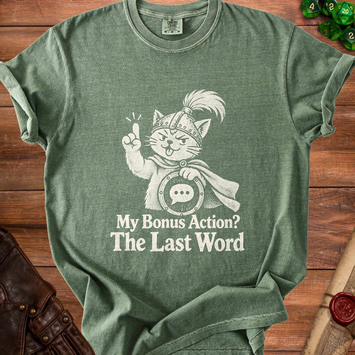Green t-shirt with a white graphic of a cat in a helmet asking "My Bonus Action? The Last Word."