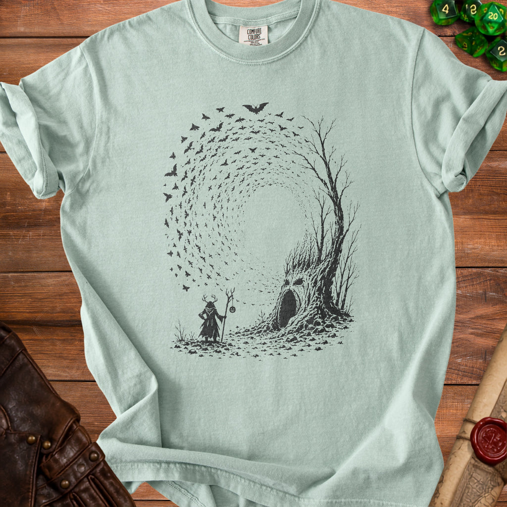 Mint t-shirt with black graphic of wizard and haunted tree with bats.