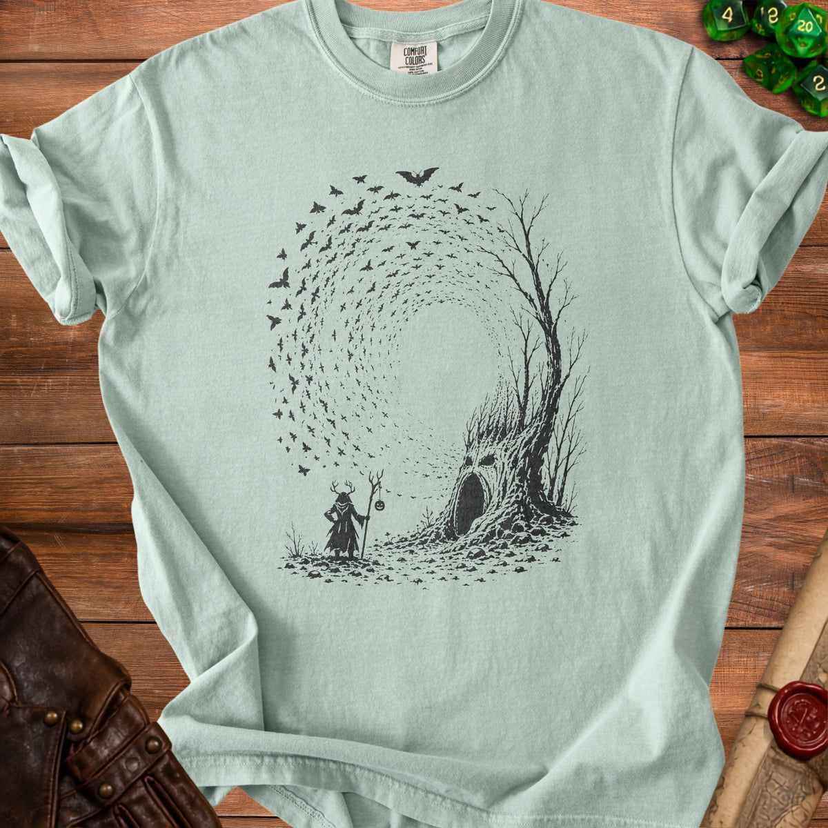 Mint t-shirt with black graphic of wizard and haunted tree with bats.