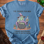Blue t-shirt with cartoon witch stirring cauldron, holding poison bottle. Text says "I'VE COOKED FOR MEN" and "I SHOULD HAVE POISONED SO YEAH, I DO HAVE SELF CONTROL".