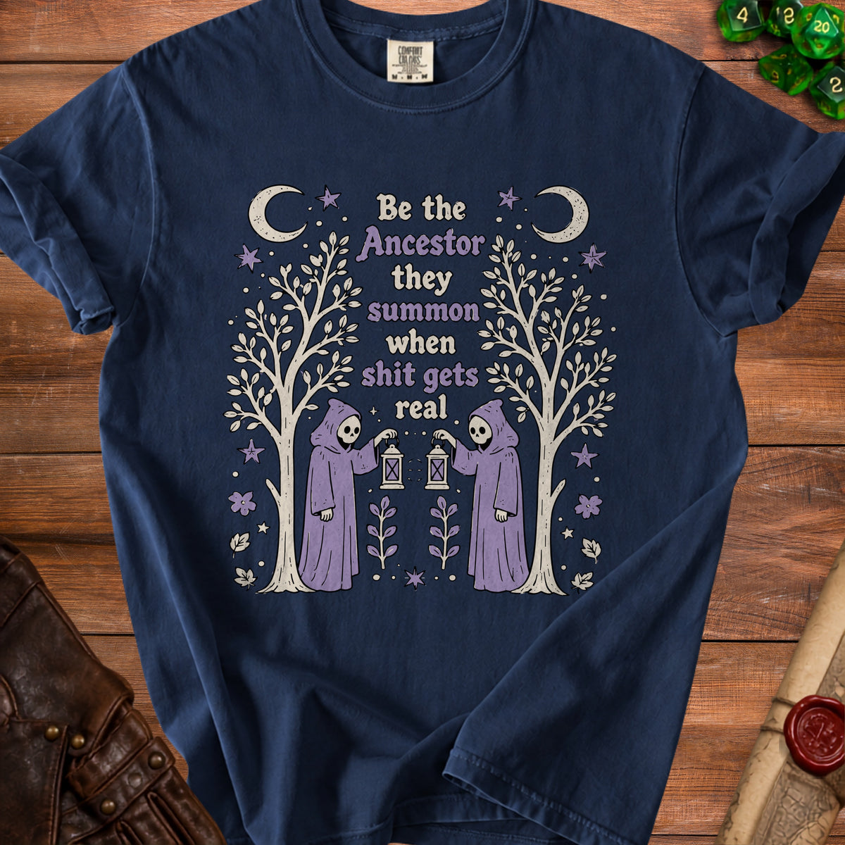 Navy t-shirt with "Be the Ancestor they summon when shit gets real" text.