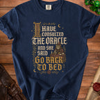 Navy t-shirt with "I have consulted the oracle and she said go back to bed" text.