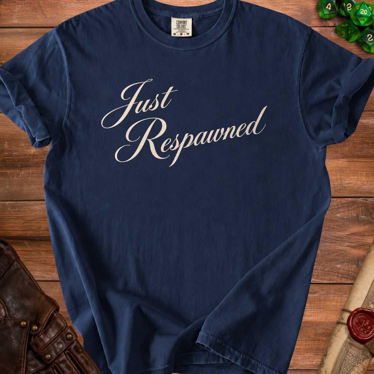 Navy t-shirt with cream script text "Just Respawned" and a Comfort Colors tag.