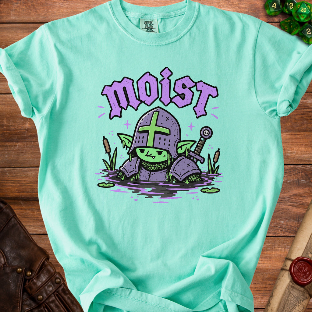 T-shirt with a mint green goblin knight in armor standing in a swamp.