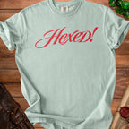 Light teal Comfort Colors t-shirt with red "Hexed!" text.