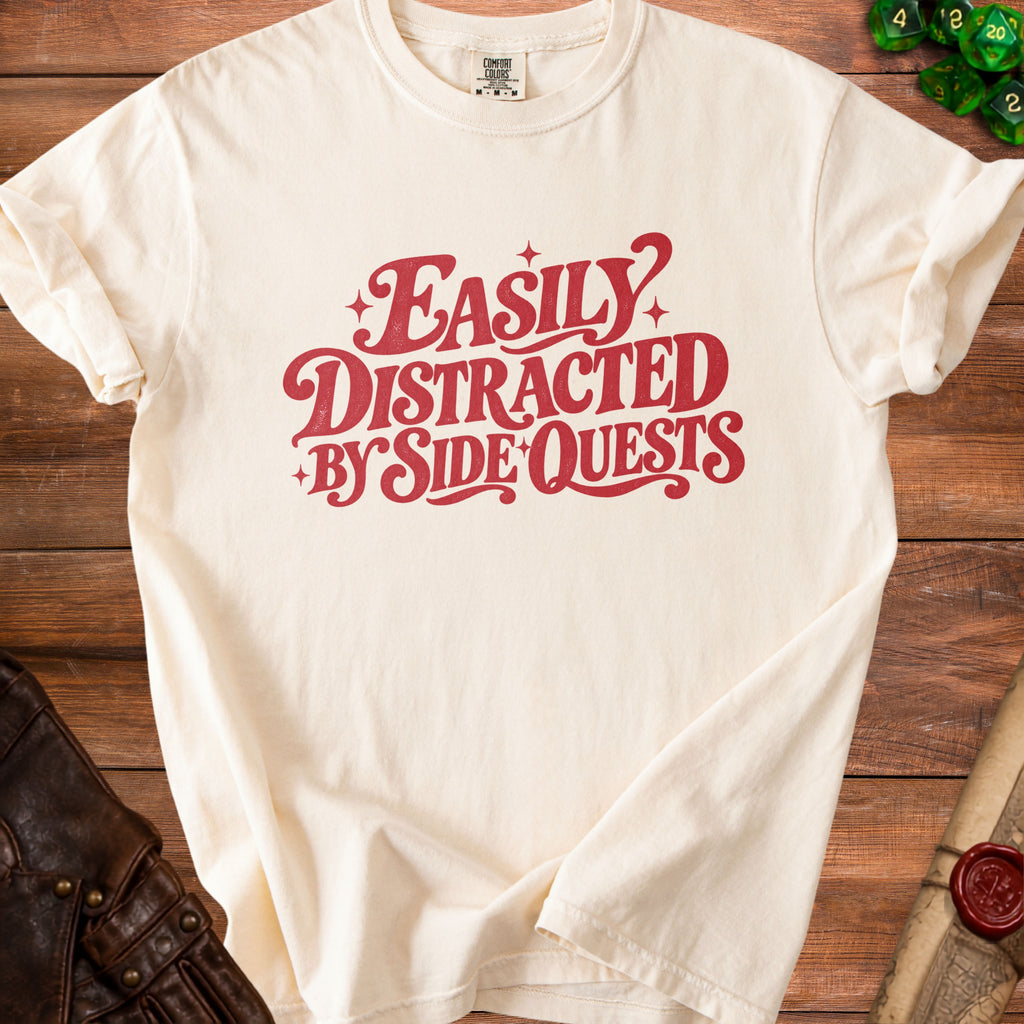 Cream t-shirt with red text reading "Easily Distracted By Side Quests."
