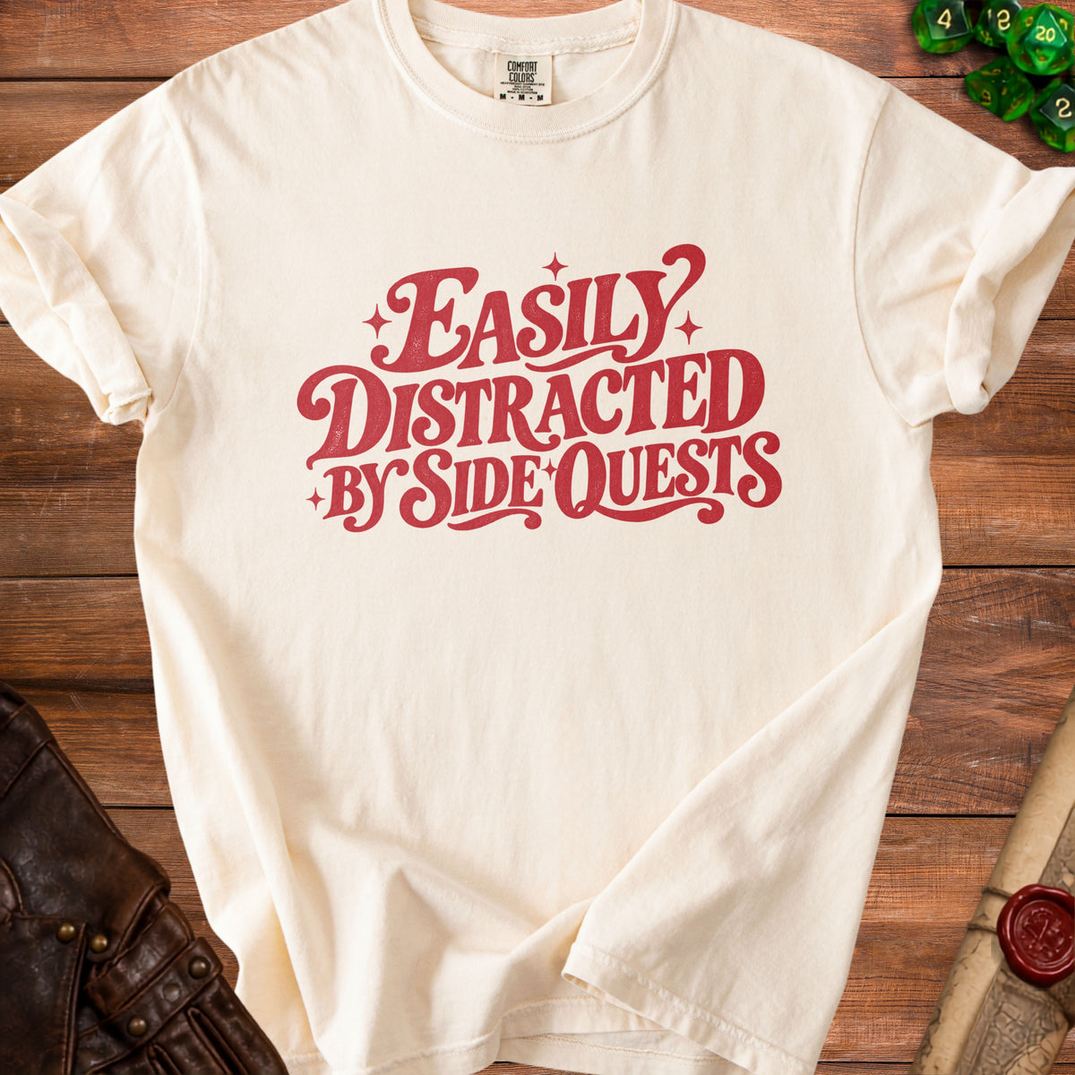 Cream t-shirt with red text reading "Easily Distracted By Side Quests."