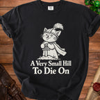 Black t-shirt with a knight cat graphic and text "A Very Small Hill To Die On".