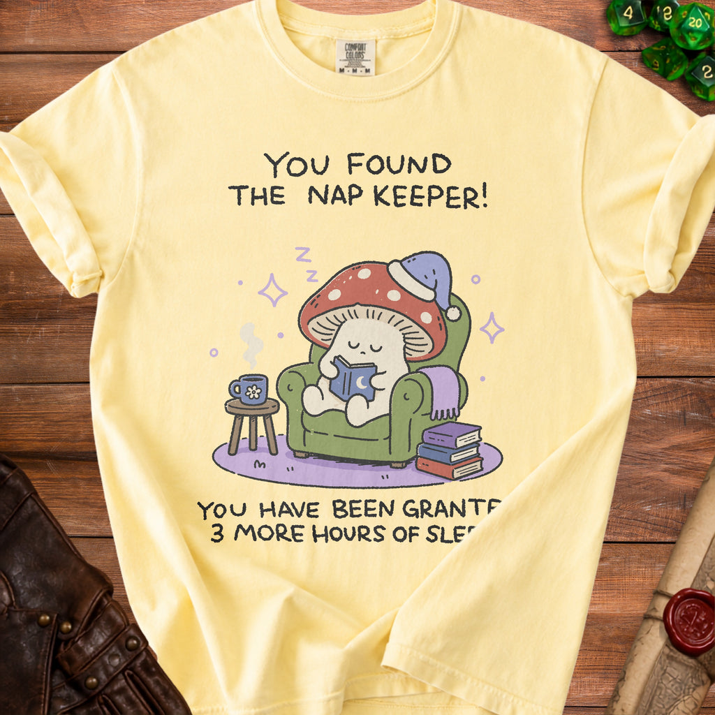 Yellow t-shirt with a mushroom character reading and the text "You found the nap keeper! You have been granted 3 more hours of sleep."