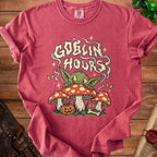 Red t-shirt with "GOBLIN HOURS" text and a goblin character on mushrooms.