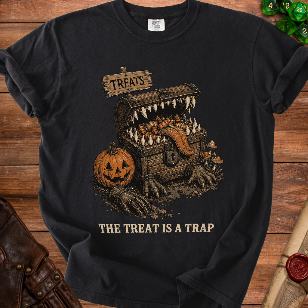 Black t-shirt with a monster chest, pumpkin, and text "The Treat Is A Trap".