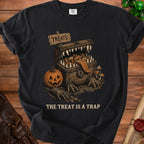 Black t-shirt with a monster chest, pumpkin, and text "The Treat Is A Trap".