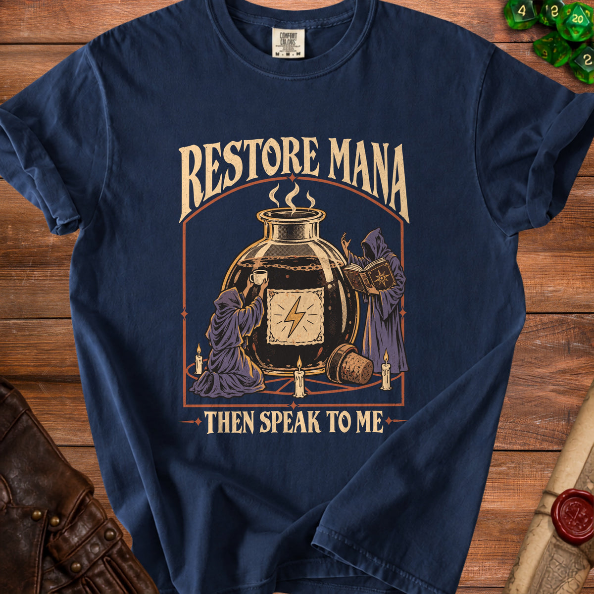 Navy blue t-shirt with "Restore Mana" and hooded figures around a potion bottle.