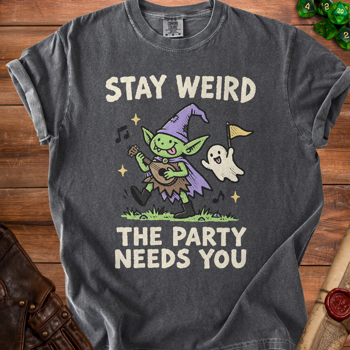 Dark gray t-shirt with a goblin playing a lute and a ghost saying "Stay Weird The Party Needs You."