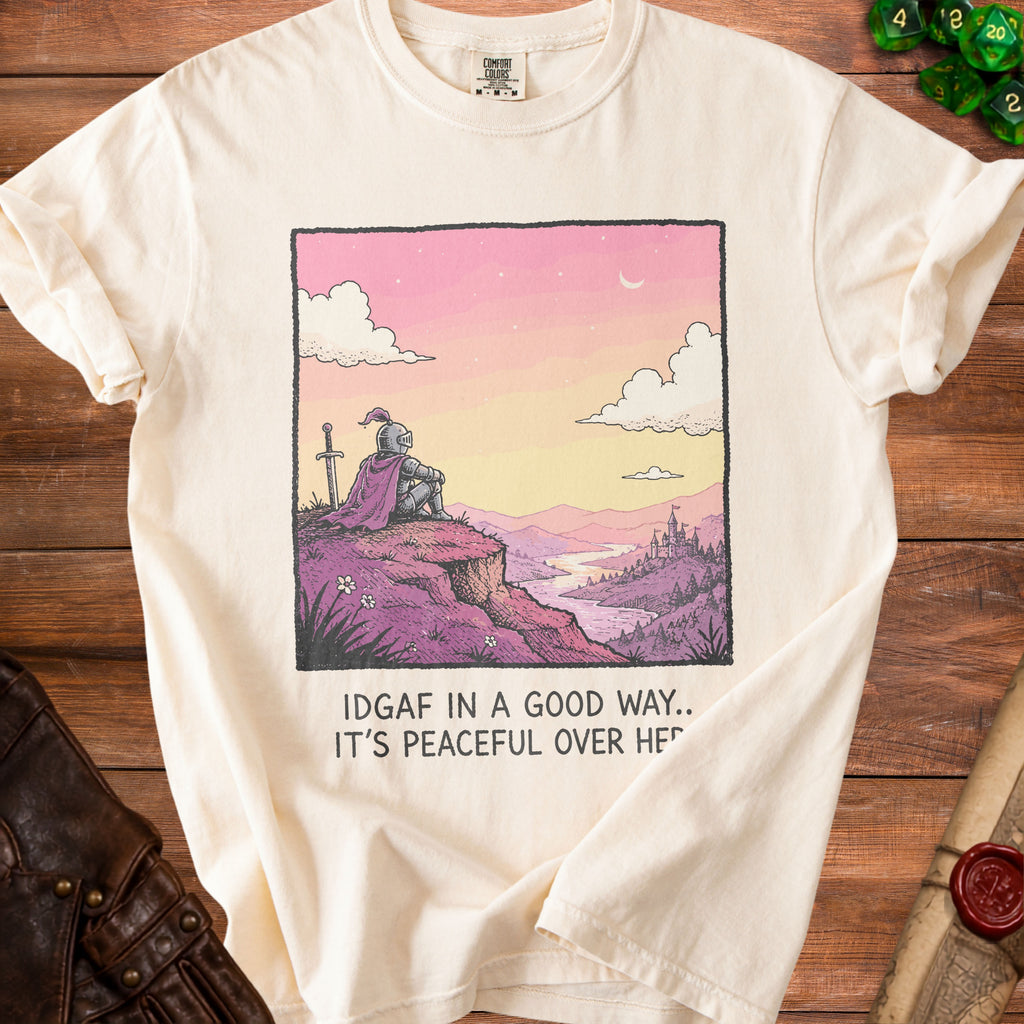 Cream t-shirt with knight graphic and text "IDGAF IN A GOOD WAY.. IT'S PEACEFUL OVER HE".