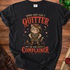 Black t-shirt with a graphic reading "Momma didn't raise a quitter but she sure raised a complainer" featuring a cat.
