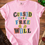 Pink t-shirt with "Cursed With Free Will" graphic and broken compass.