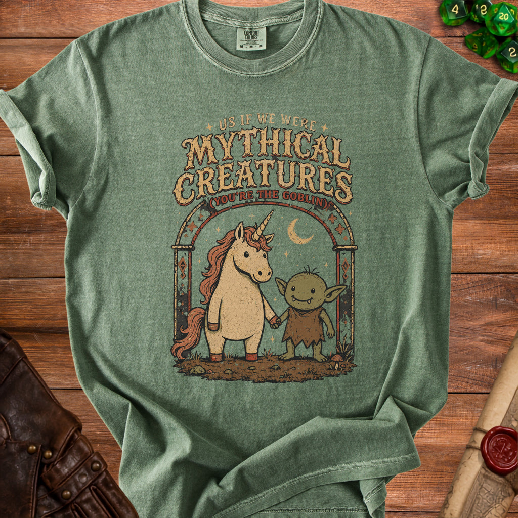 Green t-shirt with unicorn and goblin art and text "Mythical Creatures (You're The Goblin)".