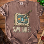 T-shirt with "SAVE FAILED CONTINUE ANYWAY" text and a sword in a broken game cartridge.