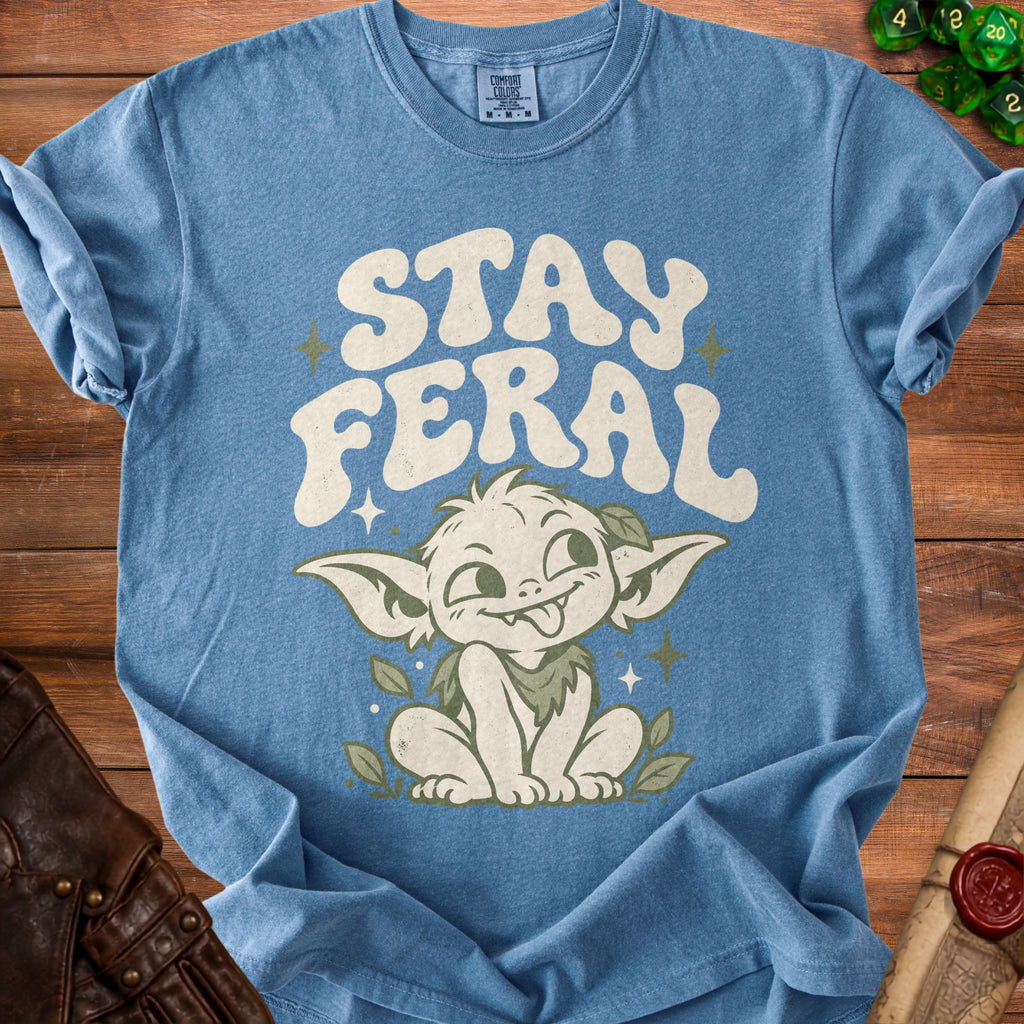 Blue t-shirt with a goblin and text "STAY FERAL".