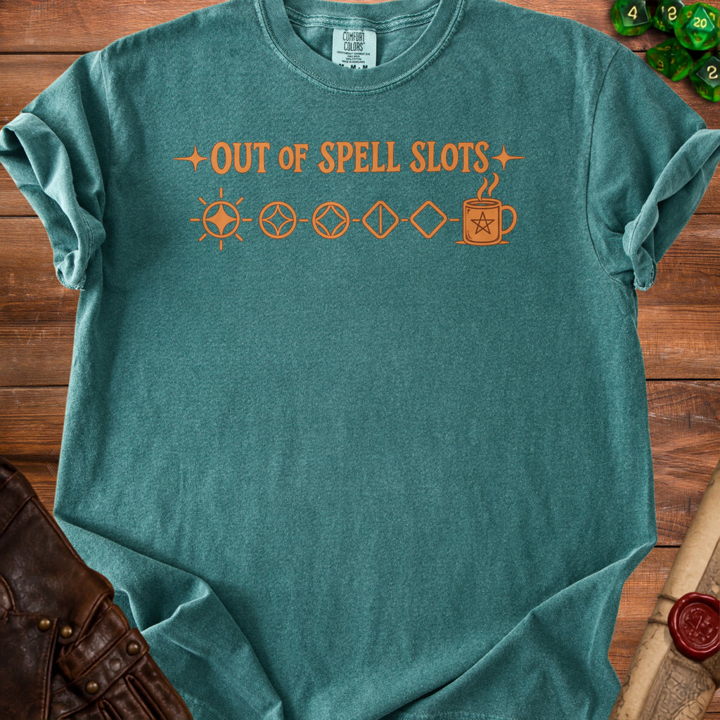 Teal t-shirt with orange text "OUT OF SPELL SLOTS" and dice icons.