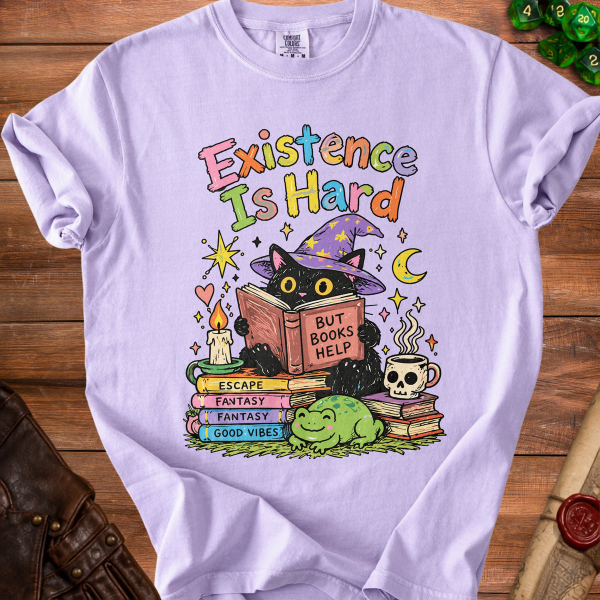 Black cat in witch hat reads book "But Books Help" on stack of books with frog.