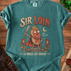 Sir Loin graphic t-shirt with a crowned steak character holding a sword and text "A NOBLE CUT INDEED".