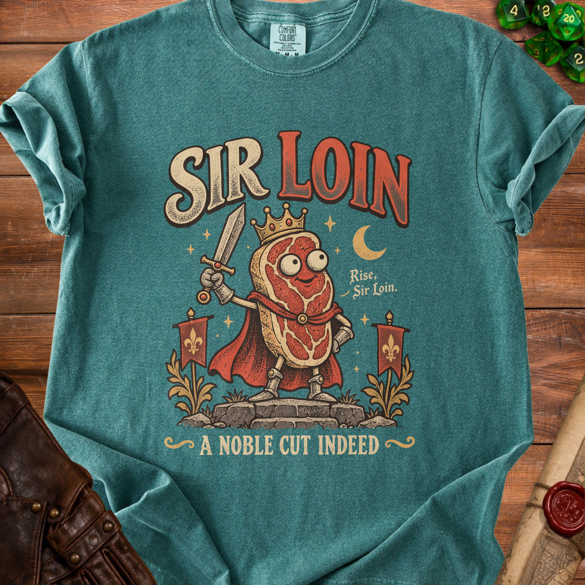 Sir Loin graphic t-shirt with a crowned steak character holding a sword and text "A NOBLE CUT INDEED".