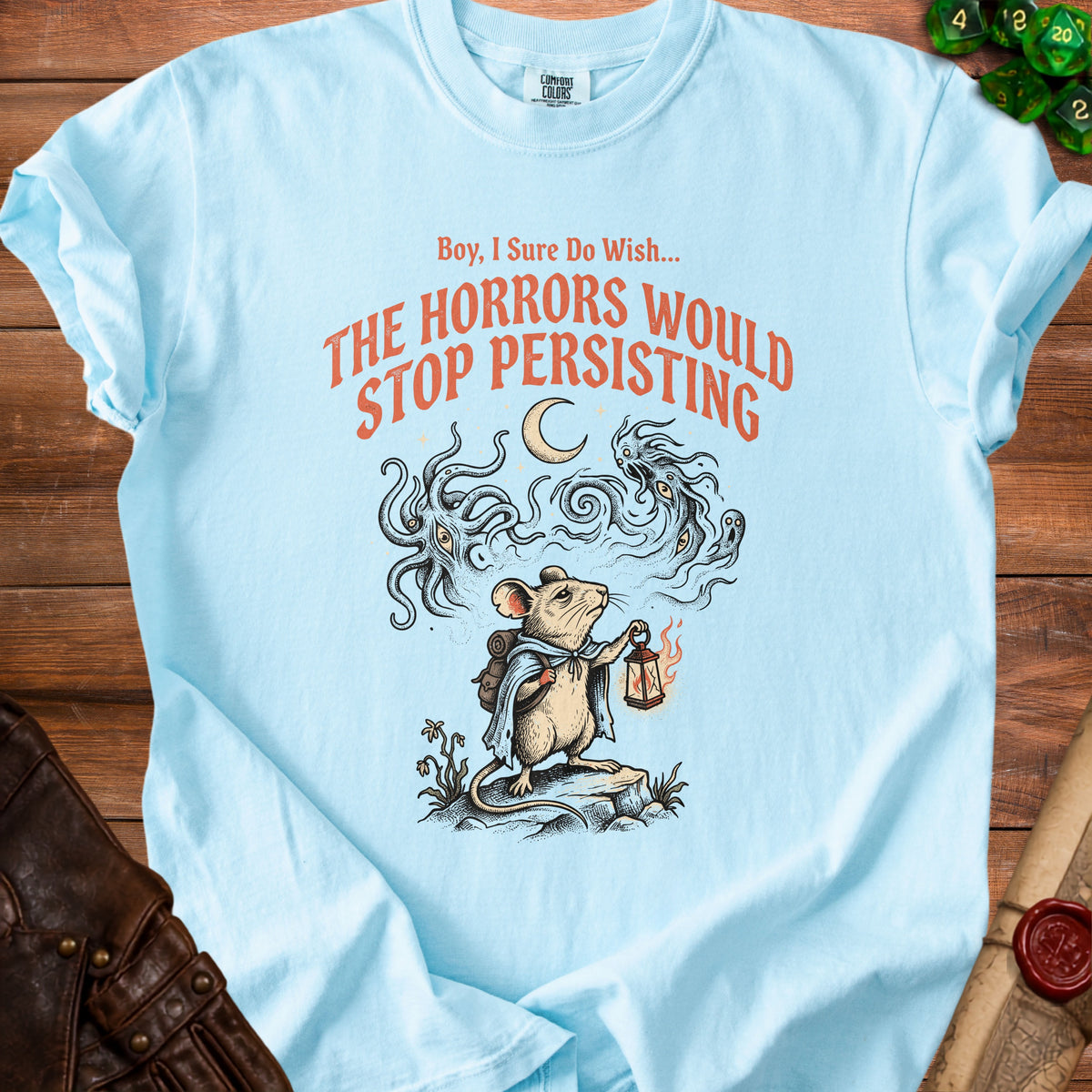 Light blue t-shirt with a mouse carrying a lantern and the text "Boy, I Sure Do Wish... THE HORRORS WOULD STOP PERSISTING."