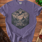 Purple t-shirt with a D20 die graphic featuring a dragon and adventurers.