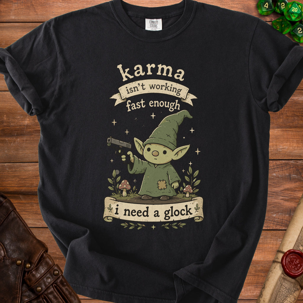 Black t-shirt with goblin graphic and text "karma isn't working fast enough i need a glock".