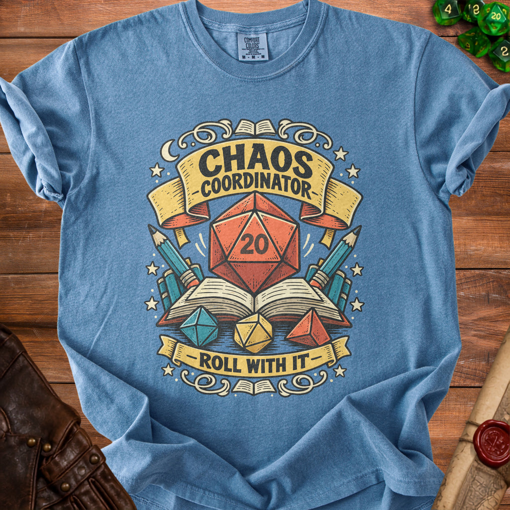 Blue t-shirt graphic with "Chaos Coordinator Roll With It" and dice imagery.