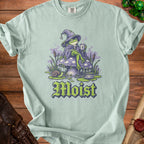 Frog wizard on mushroom with coffee, "Moist" text below.