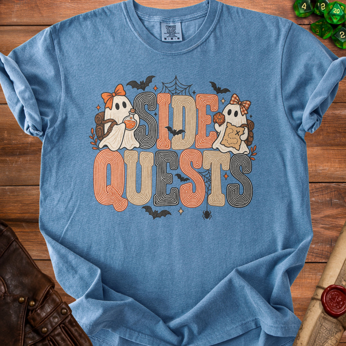 Blue Comfort Colors t-shirt with "SIDE QUESTS" text featuring ghosts and Halloween motifs.