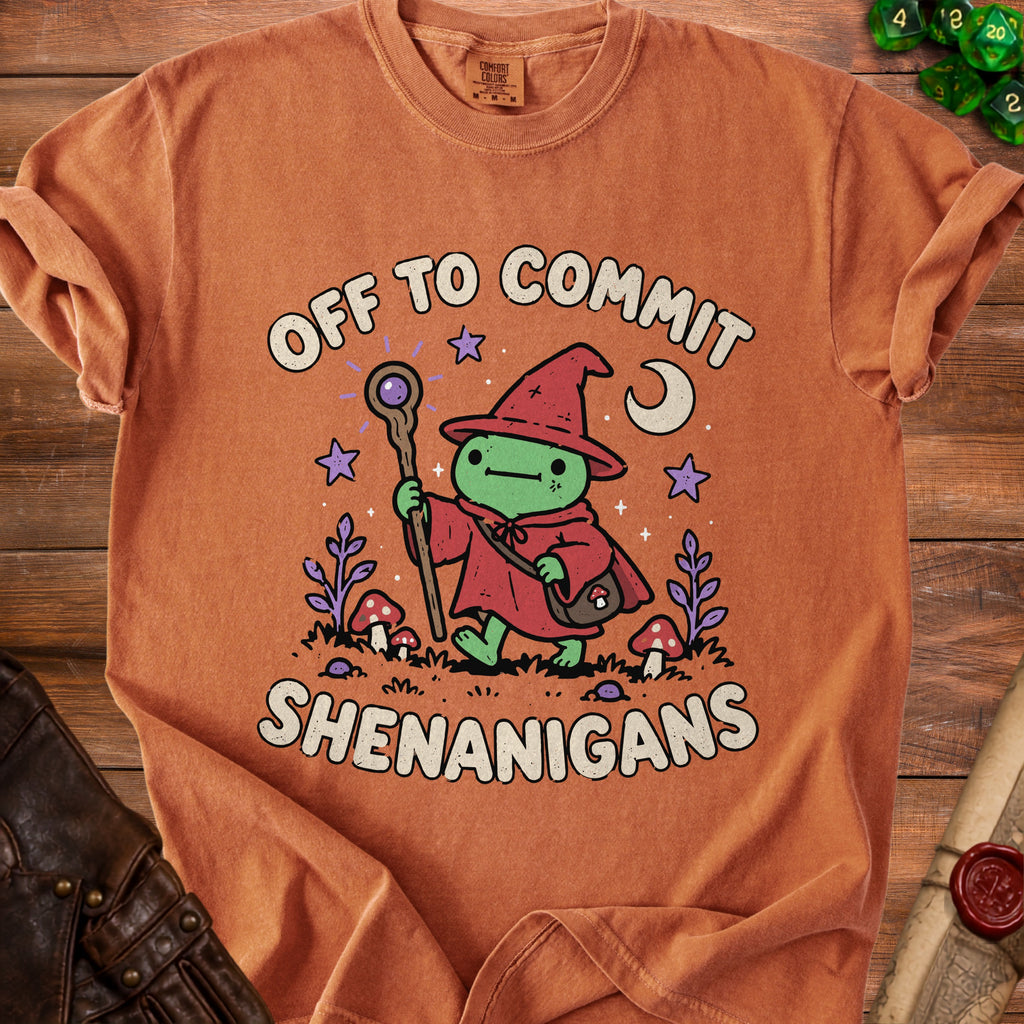 Orange t-shirt with frog wizard graphic saying "Off to commit shenanigans".