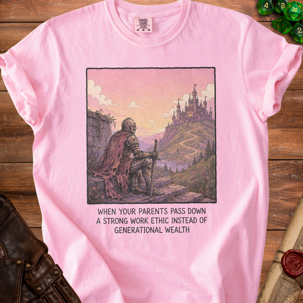 Pink t-shirt with knight looking at a castle, and text "When your parents pass down a strong work ethic instead of generational wealth".