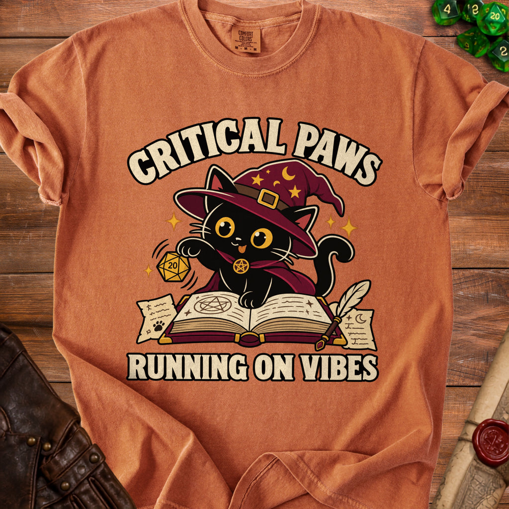 Orange t-shirt with "Critical Paws Running on Vibes" text and a wizard cat.
