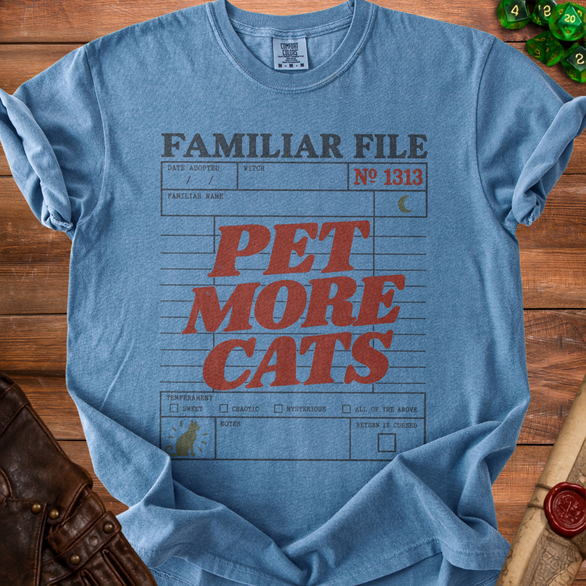 Blue Comfort Colors t-shirt with "FAMILIAR FILE PET MORE CATS" text.