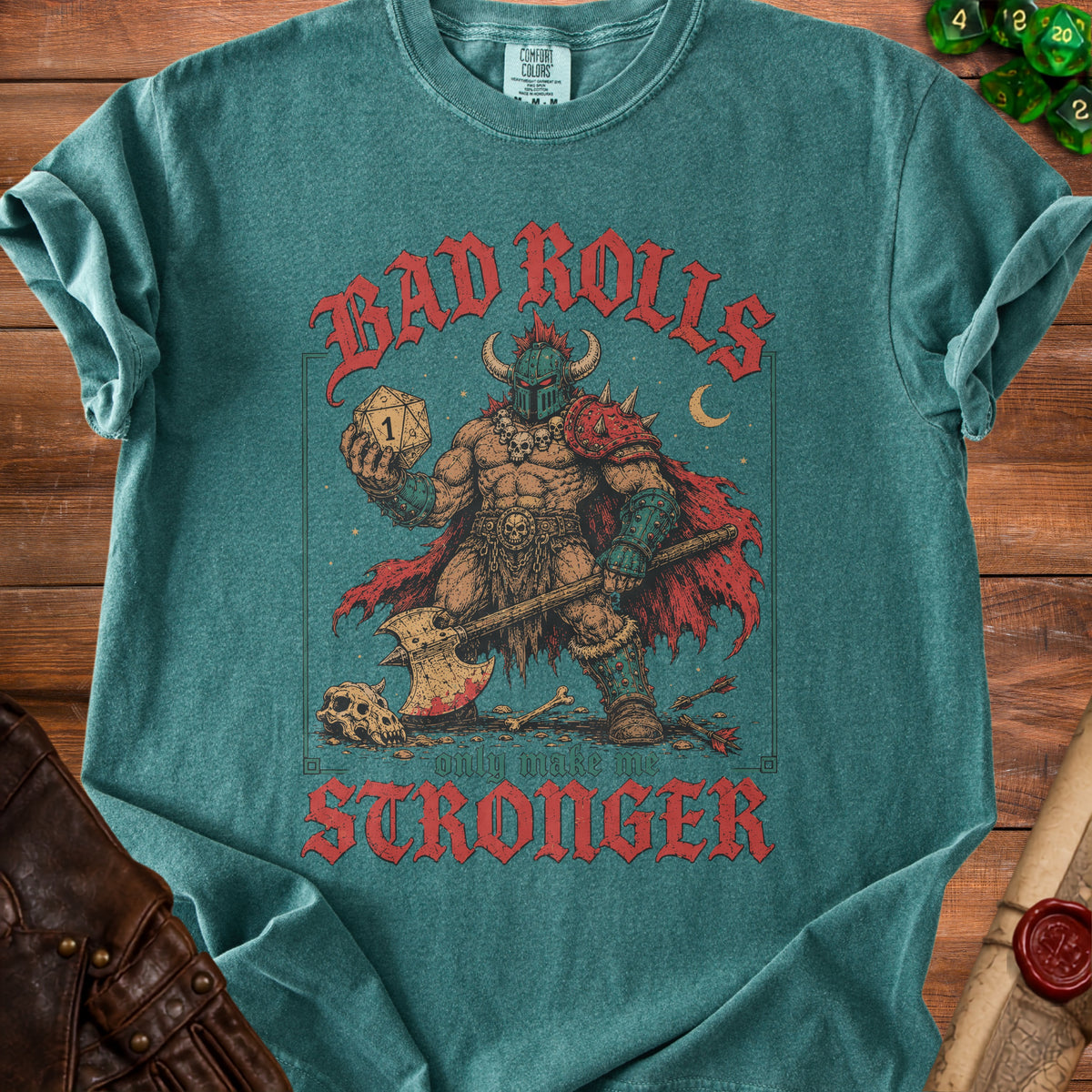 Green t-shirt with a warrior holding a die and axe; "Bad rolls only make me stronger" text.