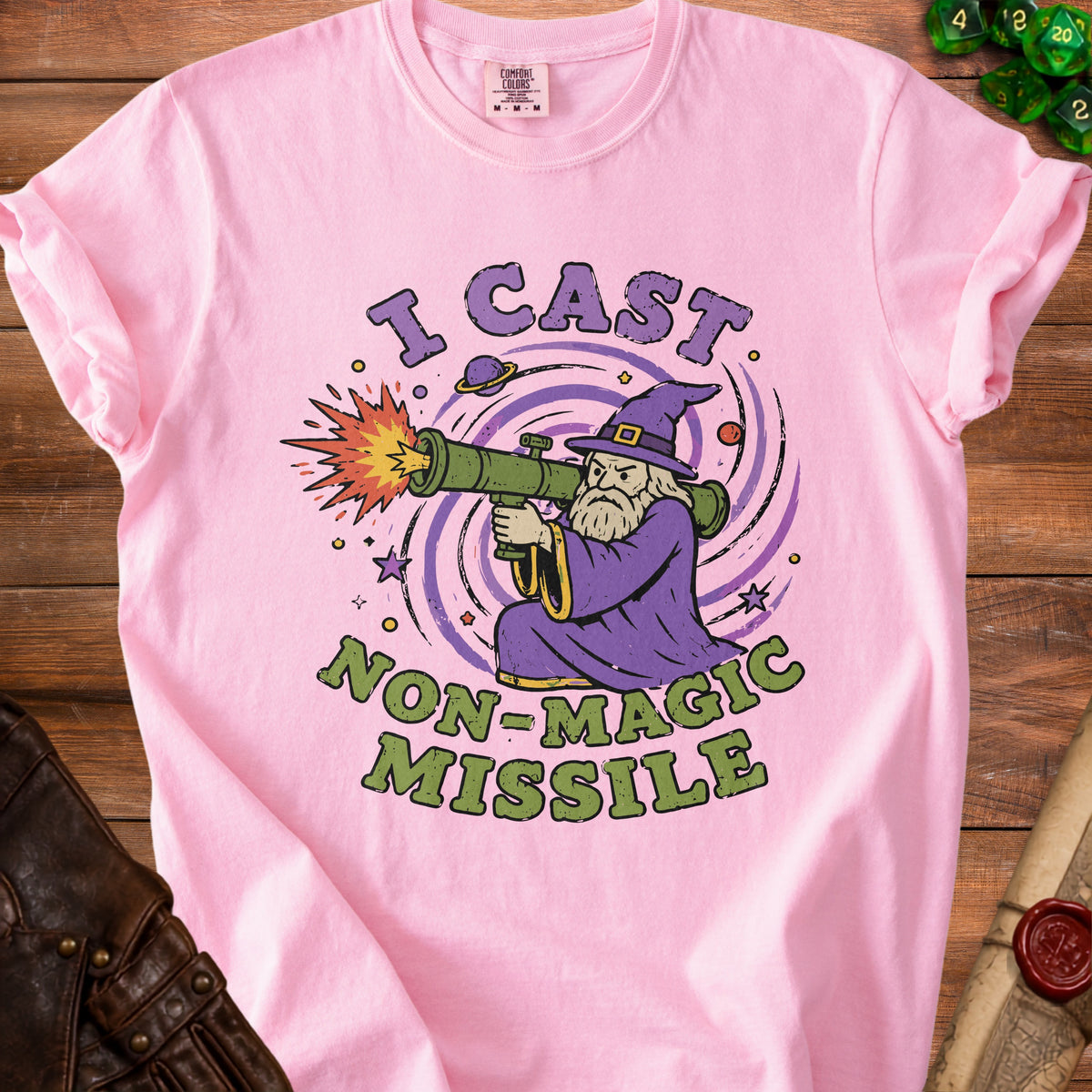 Pink t-shirt with wizard firing a rocket launcher and text "I CAST NON-MAGIC MISSILE".
