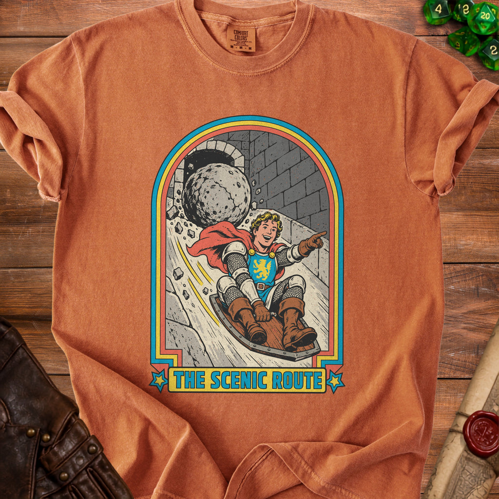 Knight in armor sledding downhill with rolling boulder and text "The Scenic Route".