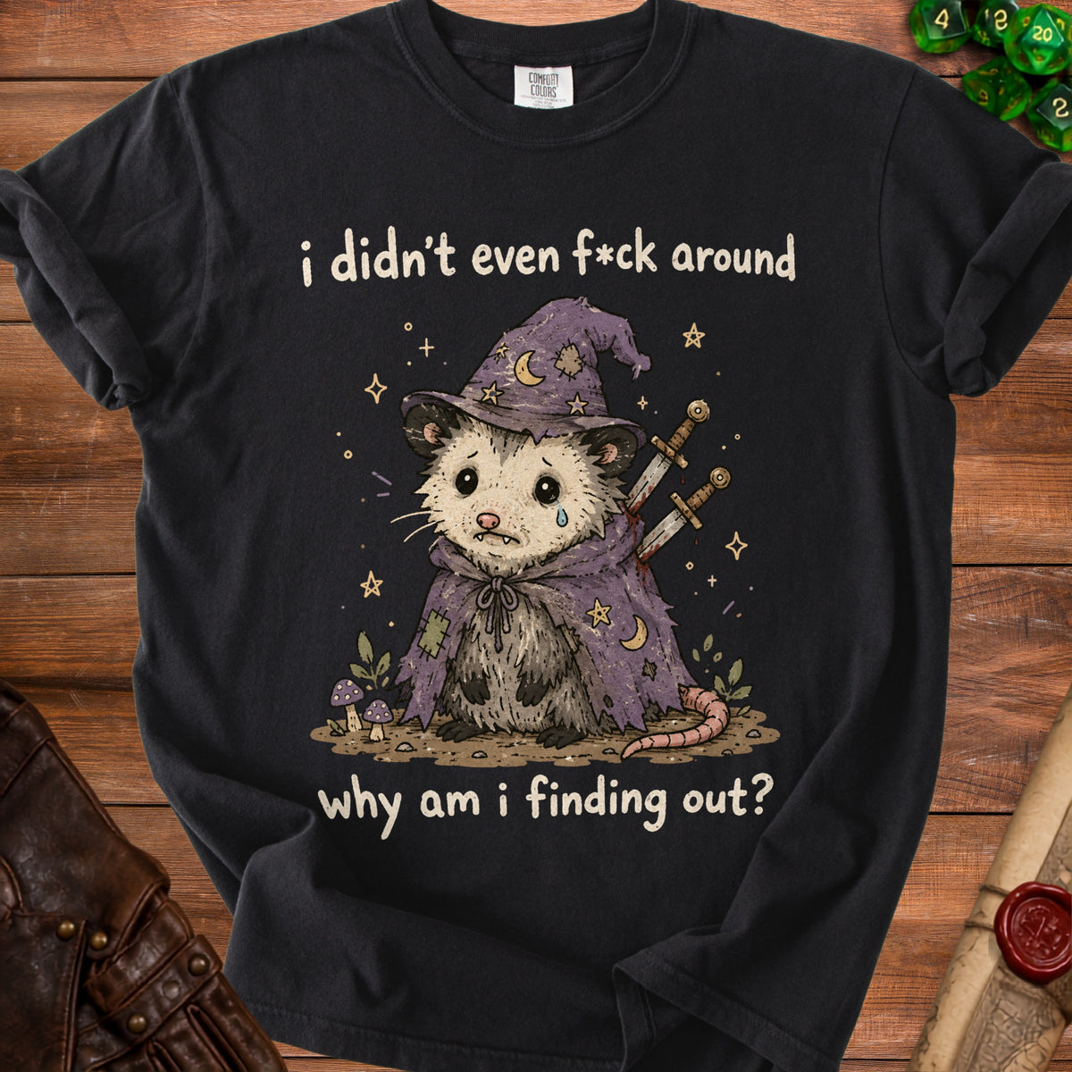 Black t-shirt with possum wizard graphic and text: "i didn't even f*ck around why am i finding out?"