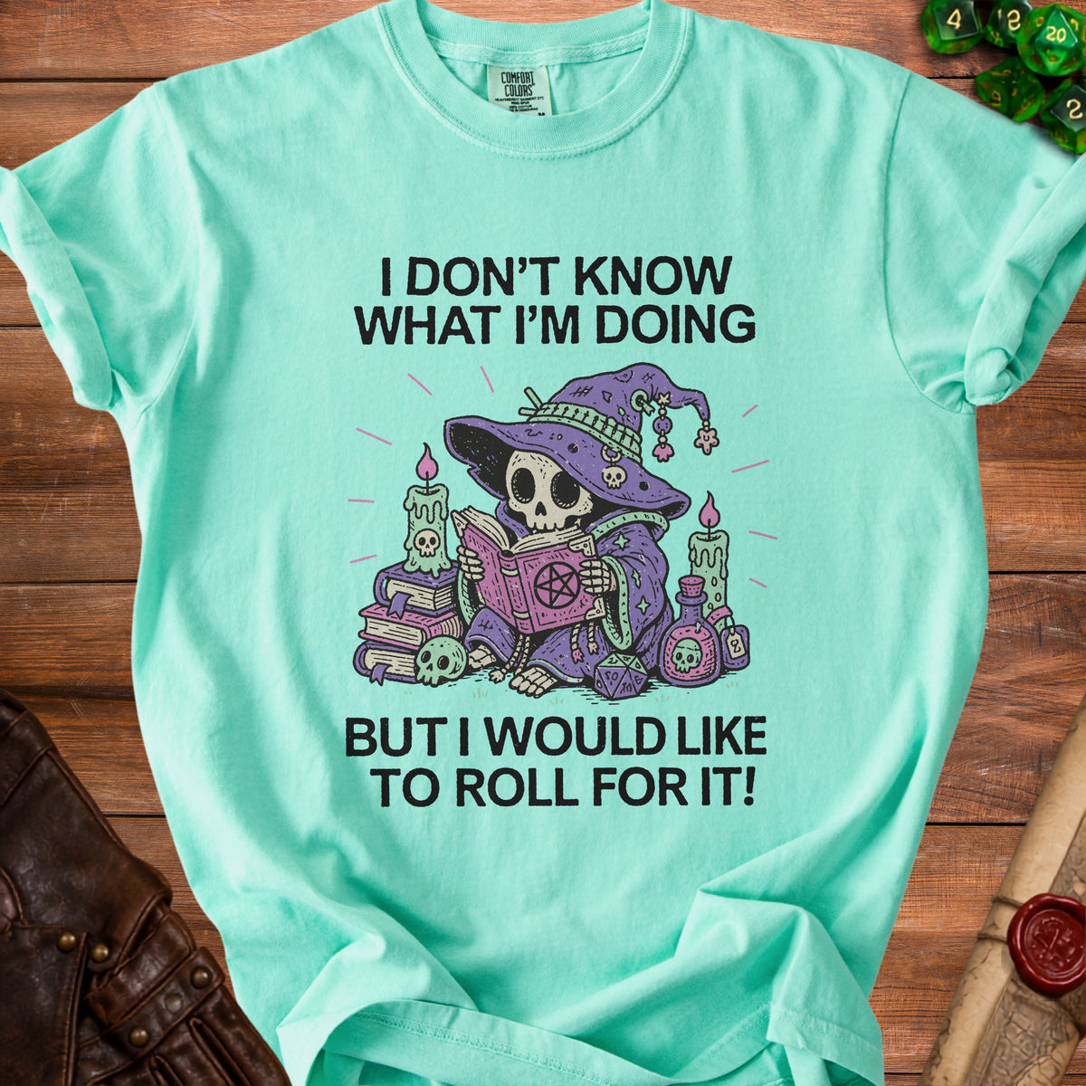 Teal t-shirt with skeleton wizard and text "I don't know what I'm doing but I would like to roll for it!".