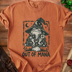 Orange t-shirt with a distressed graphic of a frog in a wizard hat reading and drinking, text "OUT OF MANA".