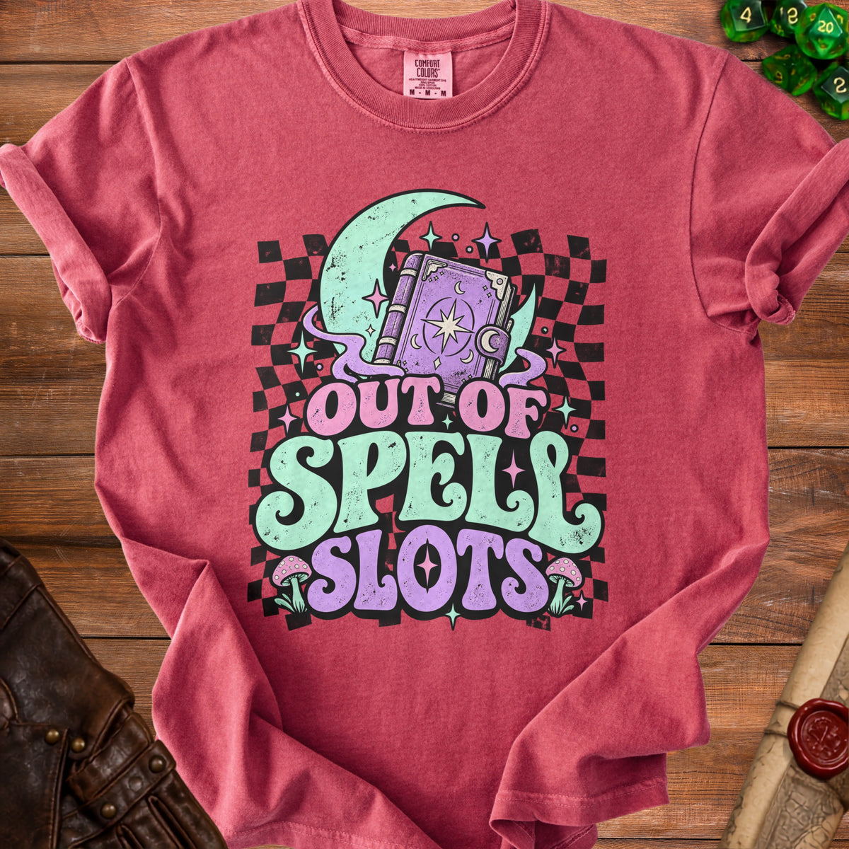 Red t-shirt with "Out of Spell Slots" text, spellbook, moon, and mushrooms graphic.