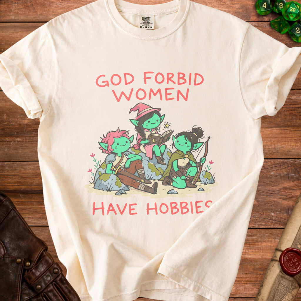 T-shirt with green goblins reading and archery, text "God Forbid Women Have Hobbies".