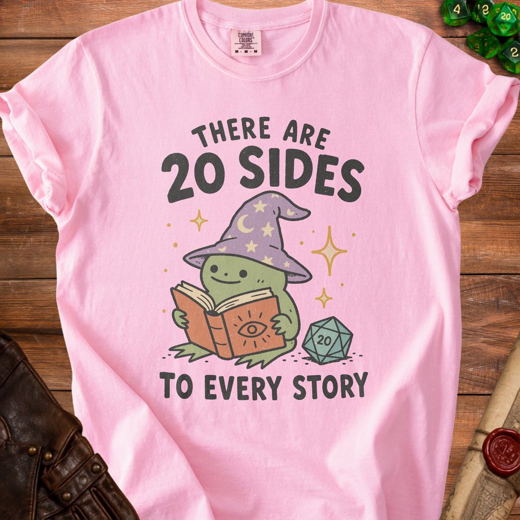 Pink t-shirt with a frog in a wizard hat reading a book and saying "There are 20 sides to every story".